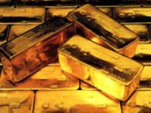 Aналитики: В 2012 году золото подорожает до 2000 долл.
